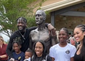 “I’ve invested wisely. ... I don’t have to ever get into the ring again for the rest of my life,” said former heavyweight champion Deontay Wilder (far left) with his family on May 25 for the unveiling of a 7-foot, 830-pound replica statue on the campus of the Tuscaloosa Tourism and Sports building.(Courtesy of Deontay Wilder)