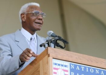 Buck O’Neil speaks at the National Baseball Hall of Fame induction in 2006. Rich Pilling/MLB via Getty Images