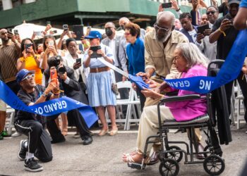 Rachel Robinson, widow of late athlete and civil rights activist Jackie Robinson, cuts the ribbon for the Jackie Robinson Museum in Lower Manhattan on Tuesday, July 26, 2022. Filmmaker Spike Lee takes a picture during the event. Photo credit: Michael Appleton, Mayoral Photography Office