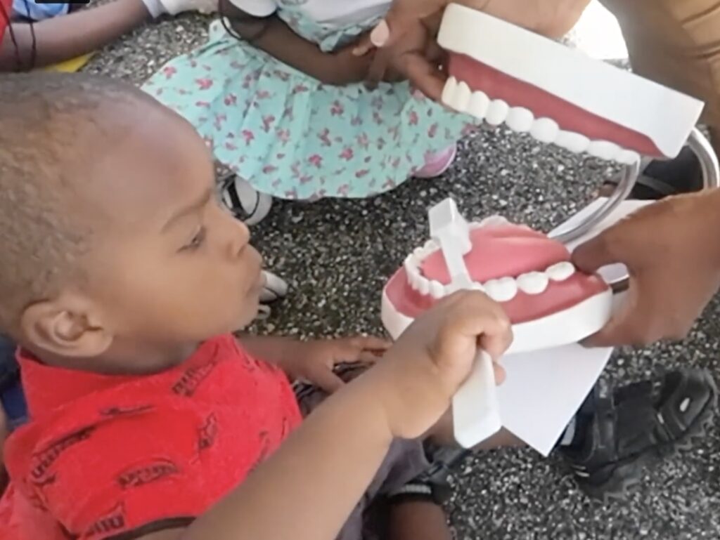 The Links, Incorporated, took part in a community collaboration in June to help children with dental health and reading skills. Photo credit: Allison Davis