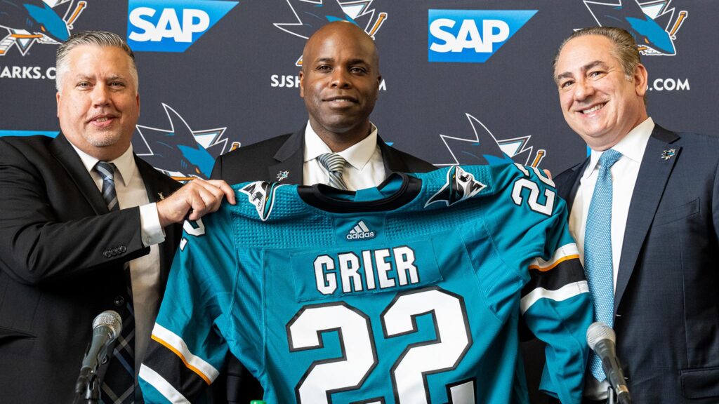 Mike Grier, center, made history in July when he was hired by the San Jose Sharks and became the first Black general manager in NHL history. Photo credit: NHL