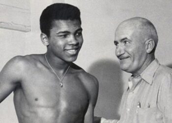 Cassius Clay, also known as Muhammad Ali, with trainer Joe E. Martin in 1960. Photo credit: The Courier-Journal
