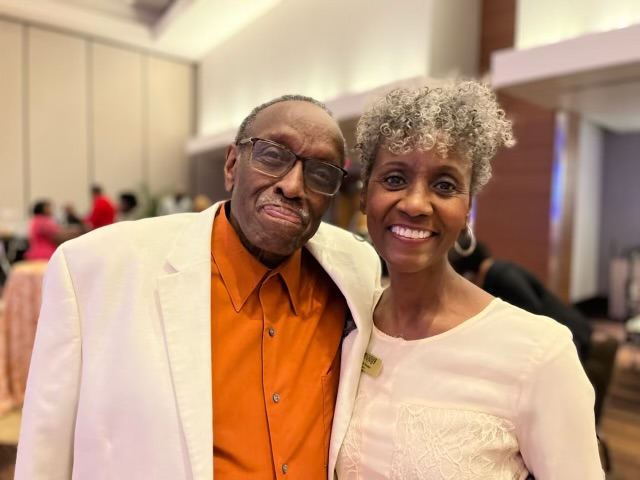 NABJ President and CBS News Chicago reporter Dorothy Tucker, right, with her father, Ernest Tucker, at the Oct. 22, 2022, celebration of Tucker's 45 years in journalism. The gathering, which was a surprise, took place at the Atlanta Marriott Marquis. Photo credit: Bobbi Jo Brooks Fine Art & Photography Studio