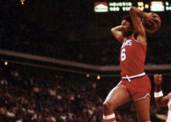 Julius Irving performs a slam dunk against the Atlanta Hawks in 1981. Photo credit: Jim Accordino