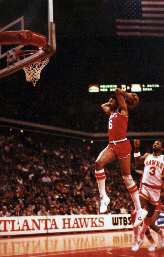 Julius Irving performs a slam dunk against the Atlanta Hawks in 1981. Photo credit: Jim Accordino