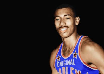 asketball player Wilt Chamberlain wearing the uniform of the Harlem Globetrotters in 1959. Photo credit: Wilt Chamberlain, Public domain