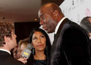 Magic Johnson, right, and wife, Cookie, at the Mercedes Benz Carousel of Hope Gala in 2014. Photo credit: Magic Johnson, Neon Tommy