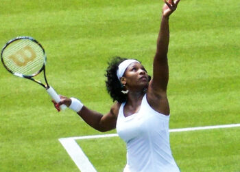 Serena Williams serves on Court 1 during her first round match against Kaia Kanepi of Estonia at Wimbledon 2008. Photo credit: Serena Williams, Public domain