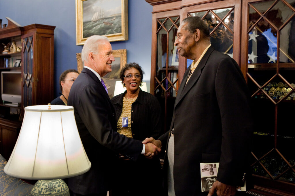 Earl Lloyd, the first Black American to play in the NBA, greets then-Vice President Joe Biden at Biden's office in the West Wing on Oct. 27, 2010. Photo credit: David Lienemann, The White House