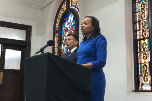 Kristen Clarke, assistant attorney general of the U.S. Department of Justice Civil Rights Division, speaks next to United States Attorney Martin Estrada of the California Central Division while announcing the largest redlining case in American history during a news conference Thursday, Jan. 12, 2023, at the Second Baptist Church in Los Angeles. Photo credit: Stefanie Dazio, The Associated Press