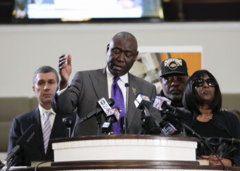Civil rights attorney Ben Crump speaks at a news conference with the family of Tyre Nichols, who died after being beaten by Memphis police officers, with RowVaughn Wells, mother of Tyre, right, and Tyre's stepfather Rodney Wells, along with attorney Tony Romanucci, left, in Memphis, Tennessee on Monday, Jan. 23, 2023. Photo credit: Gerald Herbert, The Associated Press