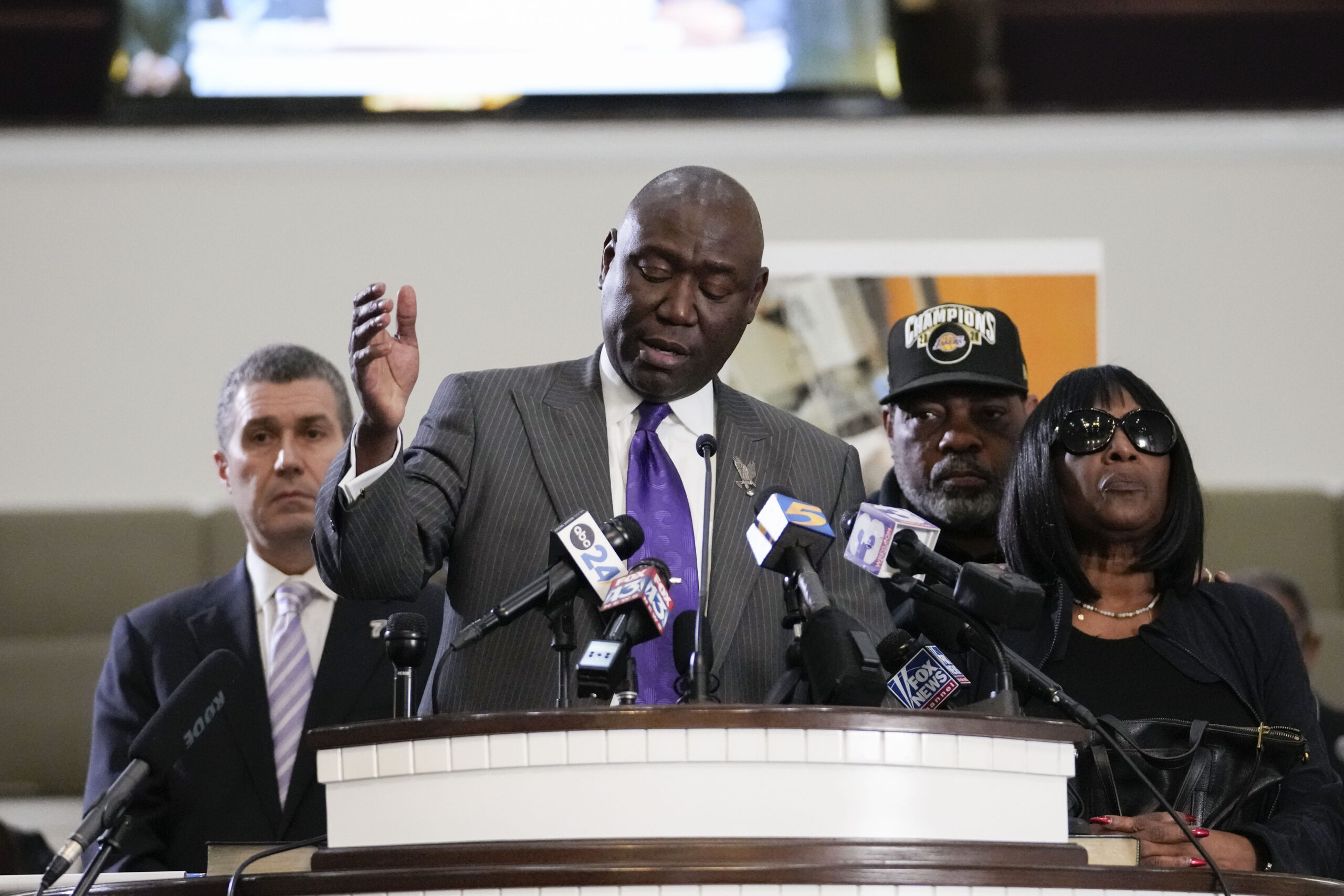 Civil rights attorney Ben Crump speaks at a news conference with the family of Tyre Nichols, who died after being beaten by Memphis police officers, with RowVaughn Wells, mother of Tyre, right, and Tyre's stepfather Rodney Wells, along with attorney Tony Romanucci, left, in Memphis, Tennessee on Monday, Jan. 23, 2023. Photo credit: Gerald Herbert, The Associated Press