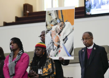 Family members and supporters hold a photograph of Tyre Nichols at a news conference in Memphis, Tennessee, Jan. 23, 2023. The U.S. Attorney’s Office said Wednesday, Jan. 25, 2023, that the federal investigation into the death of a Black man who died after a violent arrest by Memphis police “may take some time.” Speaking during a news conference, U.S. Attorney Kevin G. Ritz said his office is working with the Justice Department's Civil Rights Division in Washington as it investigates the case of Tyre Nichols, who died three days after his January 7 arrest. Photo credit: Gerald Herbert