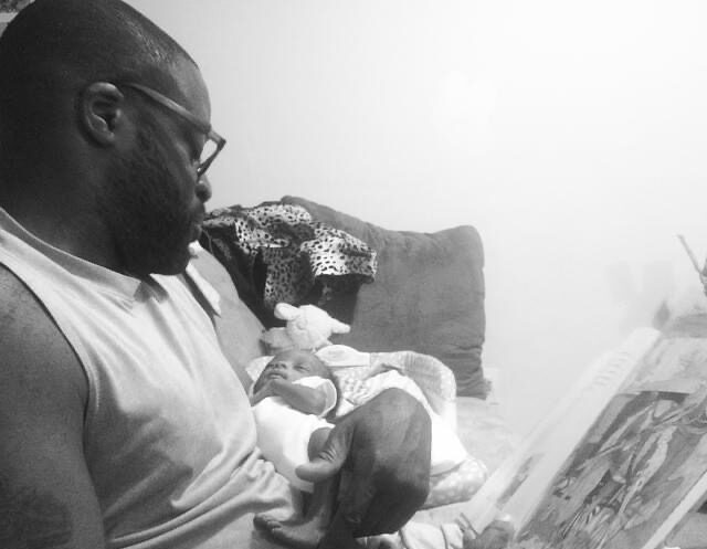 BNV staffer Damon Jackson reading to his son, Jireh, when Jireh was an infant. Jireh is now 7. Photo credit: Tamara Jackson