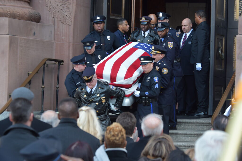 An honor guard carries the casket with the remains of Temple University Police Officer Christopher Fitzgerald from the Cathedral Basilica of Saints Peter and Paul in Philadelphia on Friday. Fitzgerald was killed in the line of duty Feb. 18. He was 31. Photo credit: Abdul R. Sulayman, The Philadelphia Tribune 