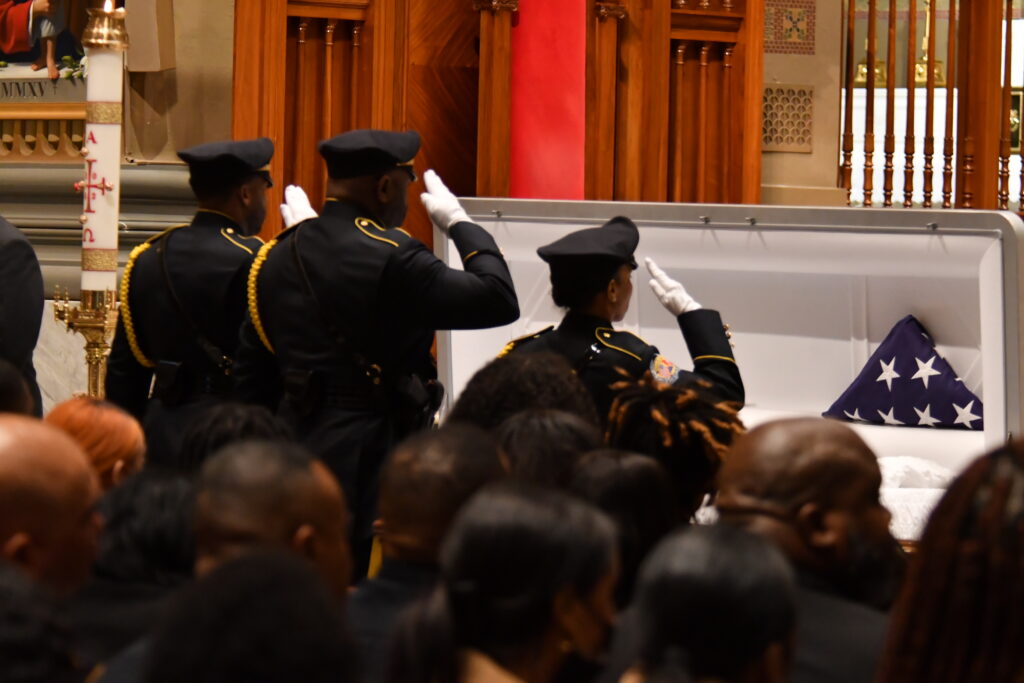 An honor guard carries a casket with the remains of Temple University Police Officer Christopher Fitzgerald from the Cathedral Basilica of Saints Peter and Paul in Philadelphia on Friday. Fitzgerald was killed in the line of duty Feb. 18. He was 31. Photo credit: Abdul R. Sulayman, The Philadelphia Tribune 