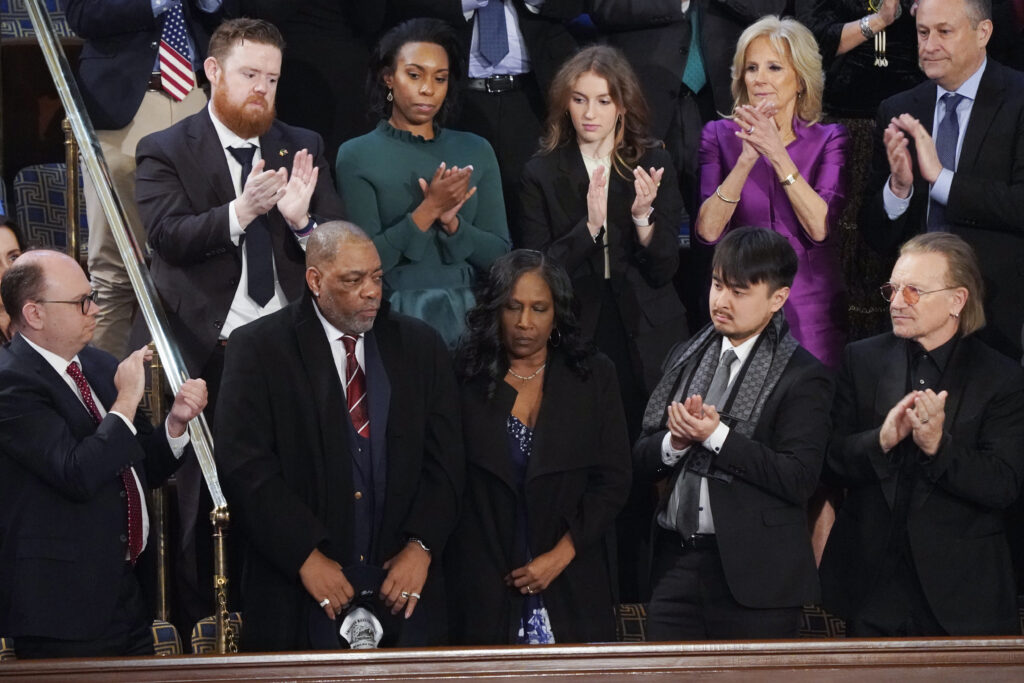 RowVaughn Wells, center, mother of Tyre Nichols, who died after being beaten by Memphis police officers, and her husband Rodney Wells, second left, are recognized by President Joe Biden as he delivers his State of the Union speech to a joint session of Congress, at the U.S. Capitol in Washington, Tuesday, Feb. 7, 2023. Photo credit: J. Scott Applewhite, The Associated Press