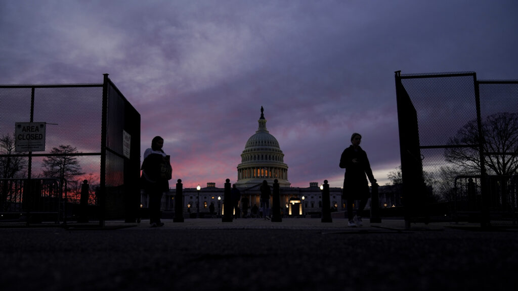 A perimeter fence around the U.S. Capitol is open for visitors to pass at sunset on Sunday, Feb. 5, 2023, in Washington, ahead of President Joe Biden's State of the Union address on Tuesday. Photo credit: Carolyn Kaster, The Associated Press 