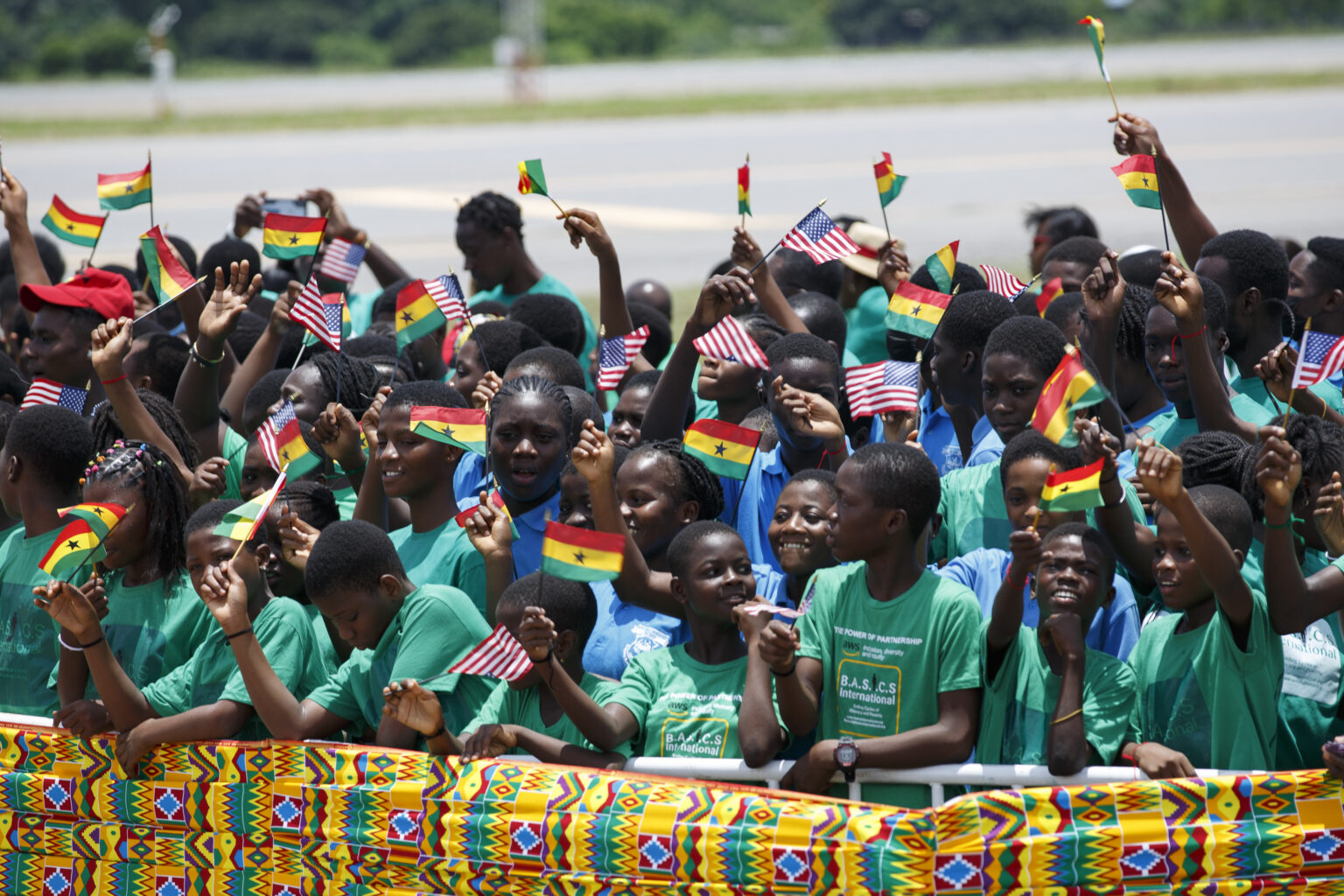 Ghanaian schoolchildren wait to greet Vice President Kamala Harris at Kotoka International Airport in Accra, Ghana, on Sunday, March 26, 2023. Harris is completing a seven-day African visit that will also take her to Tanzania and Zambia. Photo credit: Misper Apawu, The Associated Press