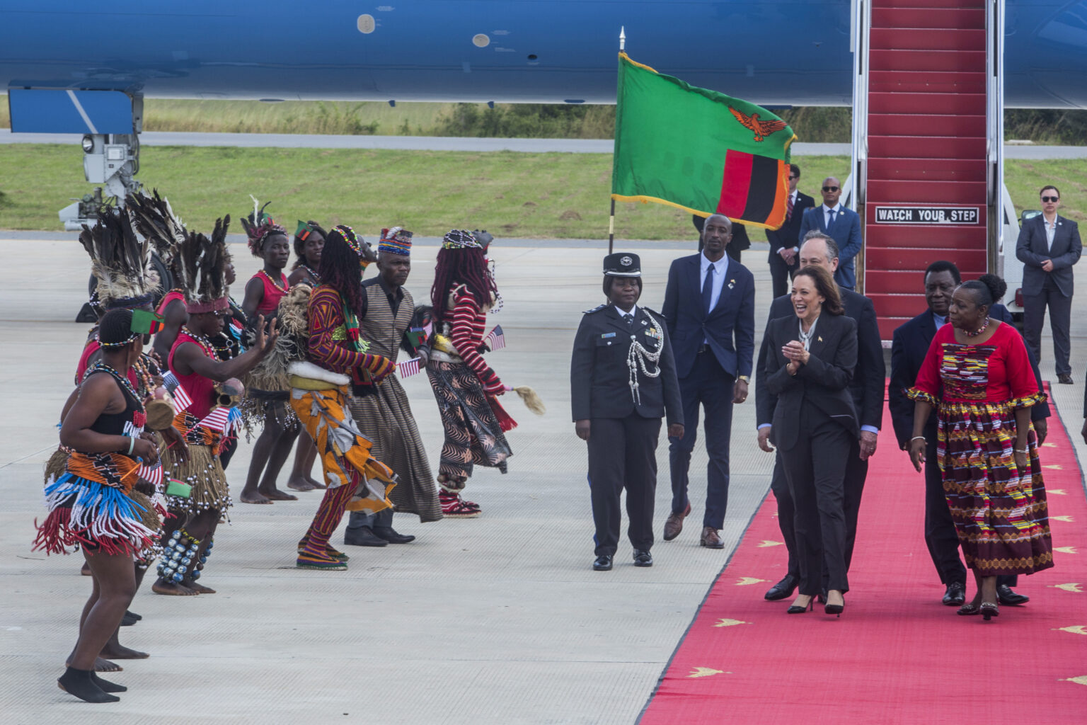 Vice President Kamala Harris, second right, is greeted by traditional dancers after landing in Lusaka, Zambia, on Friday March 31, 2023. Harris is on the last leg of a seven-day African visit that took her to Ghana and Tanzania. Photo credit: Salim Dawood, The Associated Press
