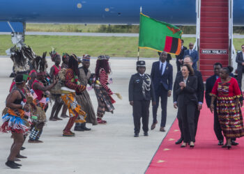 Vice President Kamala Harris, second right, is greeted by traditional dancers after landing in Lusaka, Zambia, on Friday March 31, 2023. Harris is on the last leg of a seven-day African visit that took her to Ghana and Tanzania. Photo credit: Salim Dawood, The Associated Press