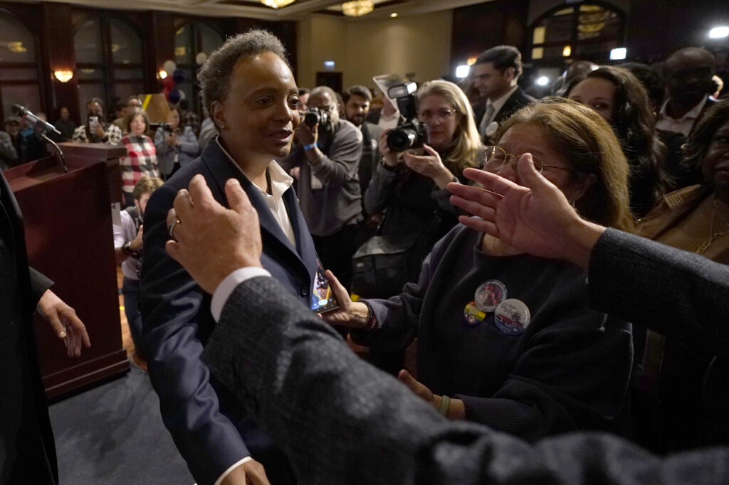 Chicago Mayor Lori Lightfoot, left, walks into the open arms of a supporter after conceding the mayoral election, late Tuesday, Feb. 28, 2023, in Chicago. Photo credit: Charles Rex Arbogast, The Associated Press
