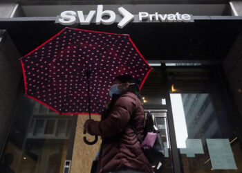 A pedestrian walks past a Silicon Valley Bank Private branch in San Francisco on Tuesday, March 14, 2023. Photo credit: Jeff Chiu, The Associated Press