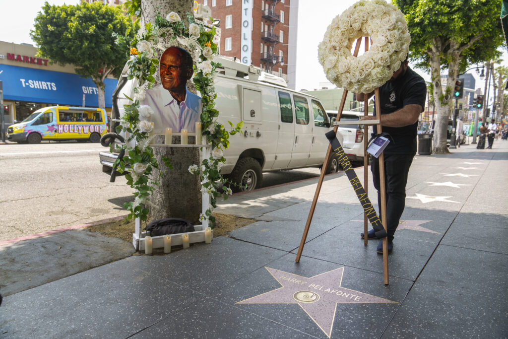 Flowers are placed on the Hollywood Walk of Fame star of actor/singer/activist Harry Belafonte on Tuesday, April 25, 2023, in Los Angeles. The civil rights and entertainment giant who began as a groundbreaking actor and singer and became an activist, humanitarian and conscience of the world, has died. He was 96. Photo credit: Damian Dovarganes, The Associated Pressl