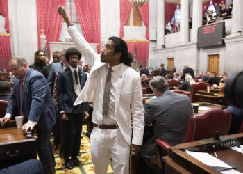Reinstated Tennessee Rep. Justin Jones, D-Nashville, raises his fist on the floor of the House chamber as he walks to his desk to collect his belongings after being expelled from the legislature on Thursday, April 6, 2023, in Nashville, Tenn. Photo credit: George Walker IV, The Associated Press