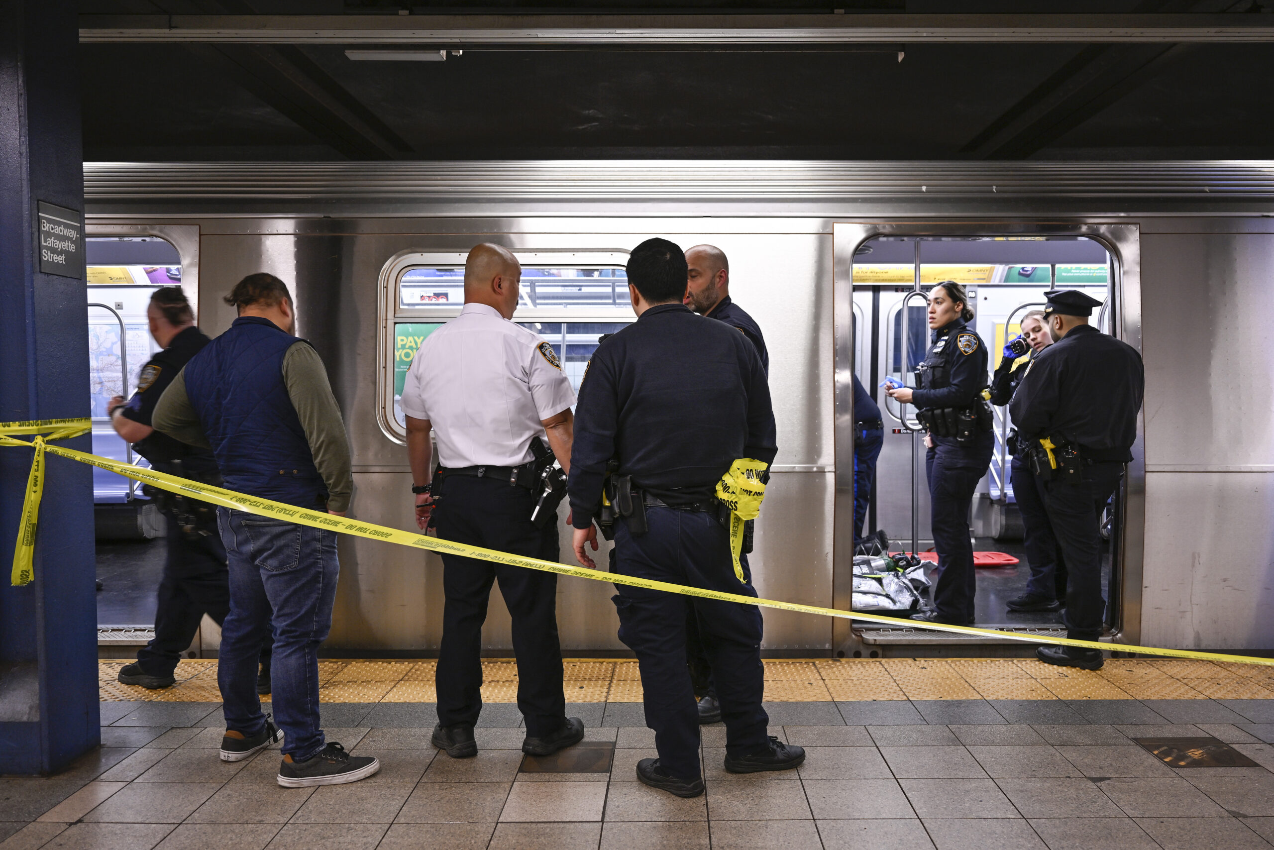 New York police officers respond to the scene where a fight was reported on a subway train on Monday, May 1, 2023, in New York. A man suffering an apparent mental health episode aboard a subway died on Monday after being placed in a headlock by a fellow rider, according to police officials and video of the encounter. Jordan Neely, 30, was shouting and pacing aboard a train in Manhattan, witnesses and police said, when he was taken to the floor by another passenger. Photo credit: Paul Martinka, The Associated Press
