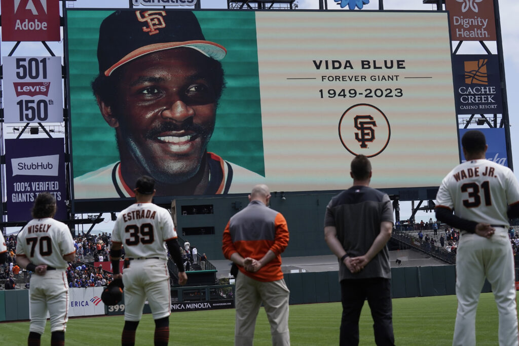 San Francisco Giants players and staff observe a moment of silence for former player Vida Blue before a baseball game between the Giants and the Milwaukee Brewers in San Francisco, Sunday, May 7, 2023. Photo credit: Jeff Chiu, The Associated Press