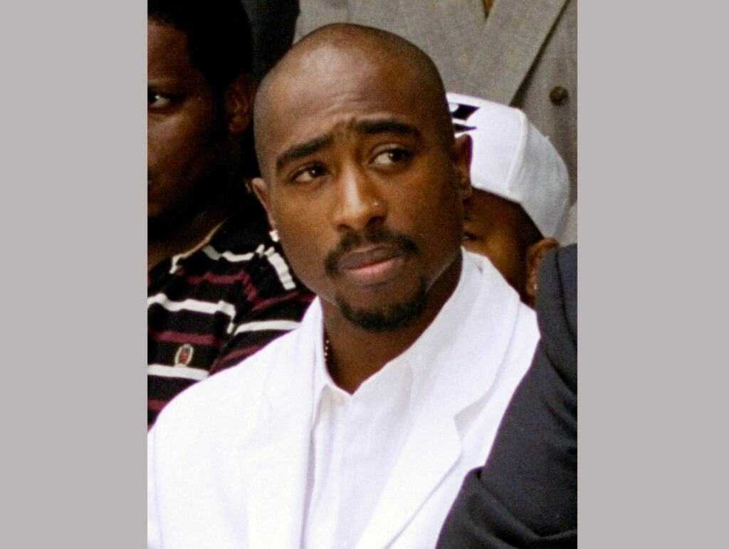 In this Aug. 15, 1996, file photo, late rapper Tupac Shakur attends a voter registration event in South Central Los Angeles. Photo credit: Frank Wiese, The Associated Press