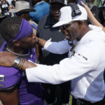 Colorado head coach Deion Sanders, right, talks to TCU running back Trey Sanders after an NCAA college football game Saturday, Sept. 2, 2023, in Fort Worth, Texas. Colorado beat TCU 45-42. Photo credit: LM Otero, The Associated Press
