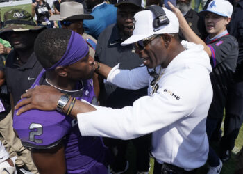 Colorado head coach Deion Sanders, right, talks to TCU running back Trey Sanders after an NCAA college football game Saturday, Sept. 2, 2023, in Fort Worth, Texas. Colorado beat TCU 45-42. Photo credit: LM Otero, The Associated Press