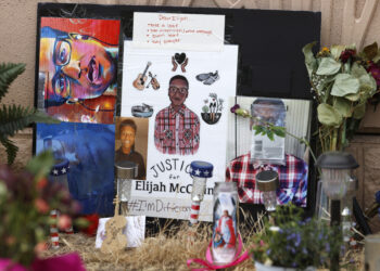 In this July 3, 2020, file photo, a makeshift memorial stands at a site across the street from where Elijah McClain was stopped by police officers while walking home in Aurora, Colo. A trial for two of the officers charged in Elijah McClain's death is set to begin Friday, Sept. 15, 2023, with jury selection. Photo credit: David Zalubowski, The Associated Press