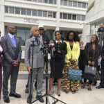 The Rev. Al Sharpton speaks outside the Richard B. Russell federal courthouse in Atlanta, on Tuesday, Sept. 26, 2023. To his left in the black dress is Fearless Fund CEO and co-founder Arian Simone. A judge Tuesday refused to block a grant program the fund administers for Black women entrepreneurs, saying a lawsuit arguing it illegally excluded other races was not likely to succeed. Photo credit: Curlan Campbell, The Associated Press