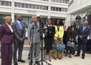 The Rev. Al Sharpton speaks outside the Richard B. Russell federal courthouse in Atlanta, on Tuesday, Sept. 26, 2023. To his left in the black dress is Fearless Fund CEO and co-founder Arian Simone. A judge Tuesday refused to block a grant program the fund administers for Black women entrepreneurs, saying a lawsuit arguing it illegally excluded other races was not likely to succeed. Photo credit: Curlan Campbell, The Associated Press