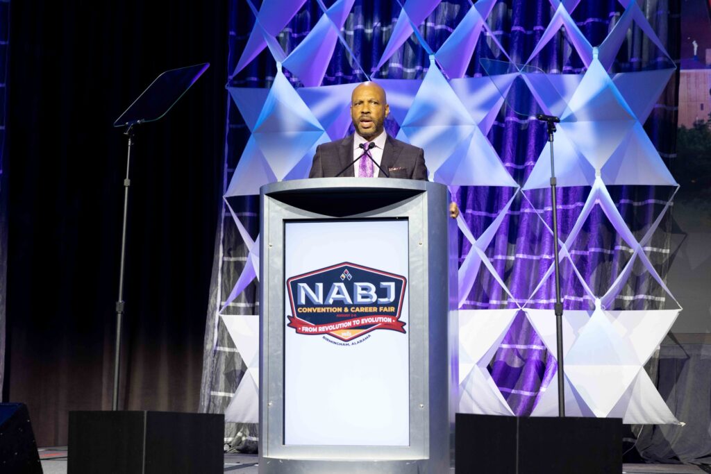 Journalist Jim Trotter accepts the Journalist of the Year award from the National Association of Black Journalists at the group's convention in BIrmingham, Alabama, in August 2023. Photo credit: NABJ