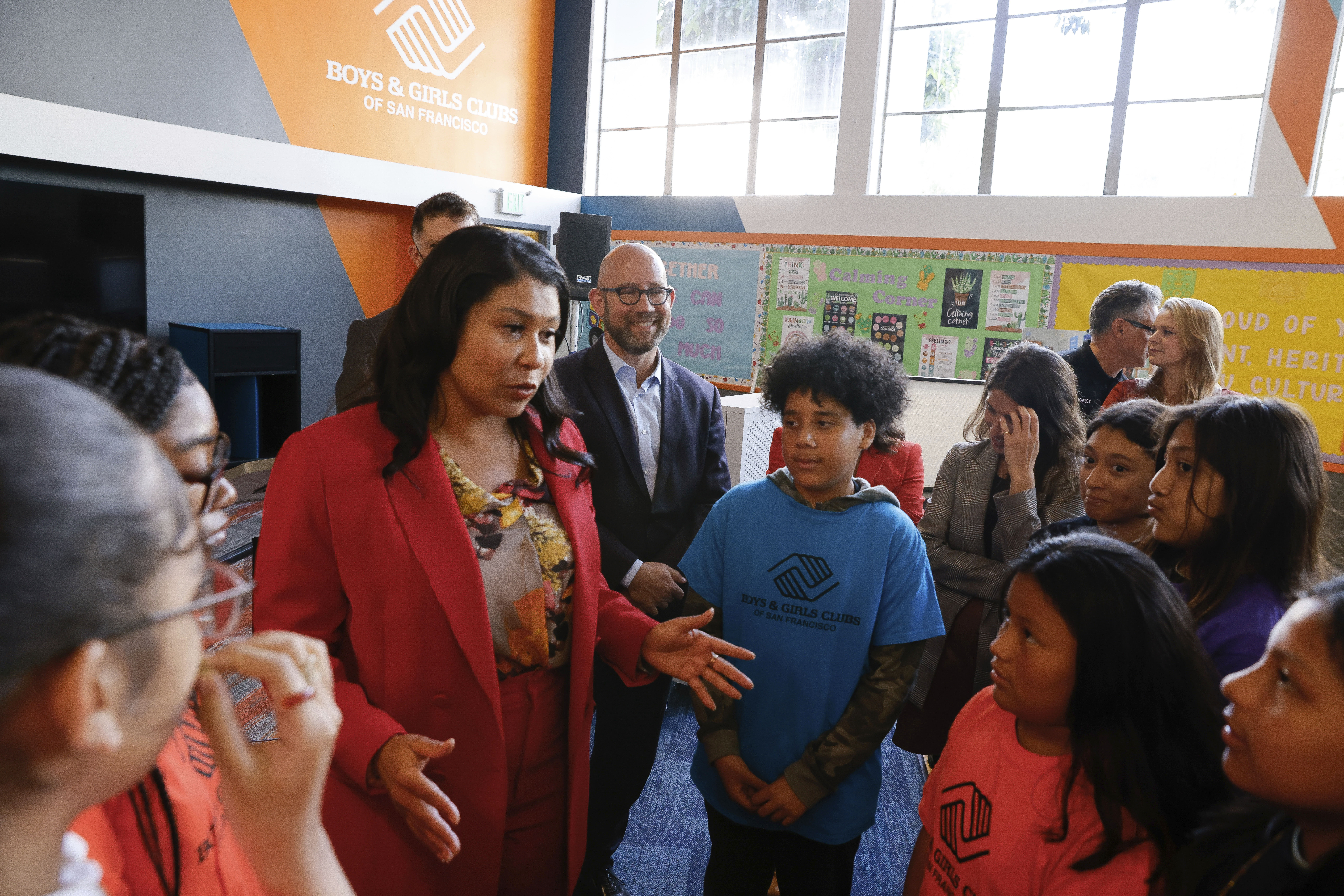 San Franciso Mayor London Breed talks with members of the Boys and Girls Clubs of San Francisco after speaking at a press event at the Boys and Girls Clubs of San Francisco Columbia Park Clubhouse during after-school programming to talk with children about how the Emergency Weather Resilience Program equipment will help keep them comfortable, safe, and healthy during extreme heat or poor air quality, on Wednesday, Sept. 20, 2023, in San Francisco. Photo credit: Lea Suzuki/San Francisco Chronicle via The