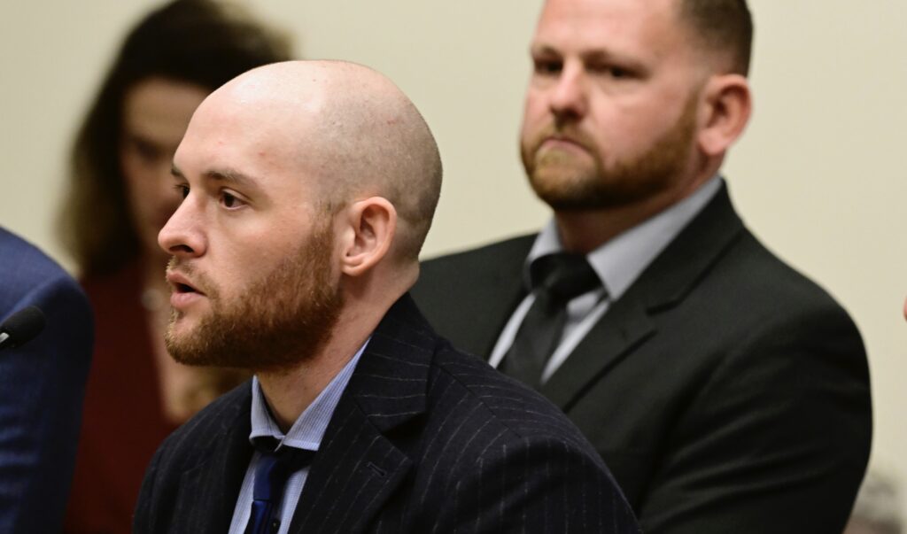Former Aurora, Colorado, Police Officer Jason Rosenblatt, left, and suspended Police Officer Randy Roedema, right, attend an arraignment at the Adams County Justice Center in Brighton, Colorado, Jan. 20, 2023. The two officers face felony charges in the 2019 death of Elijah McClain. Photo credit: Andy Cross, The Denver Post via The Associated Press