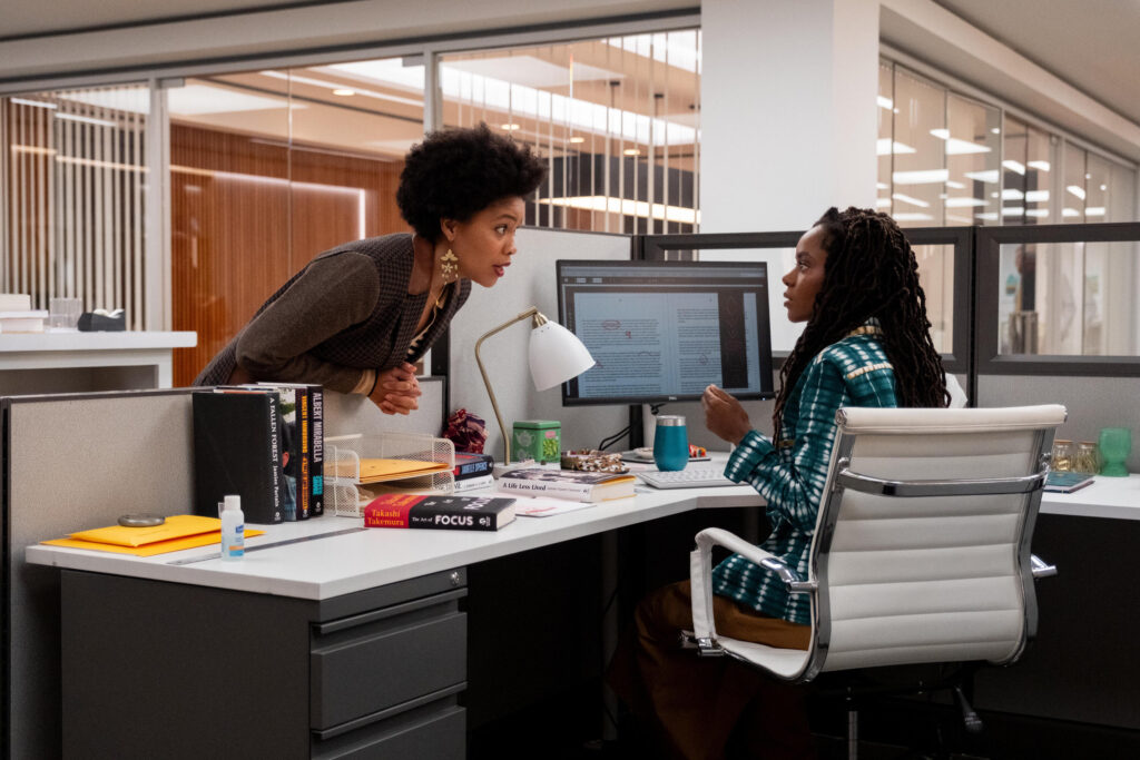 In this scene from “The Other Black Girl,” Nella, played by Sinclair Daniel, talks with co-worker Hazel-May McCall (played by Ashleigh Murray). Photo credit: Wilford Harwood, Hulu