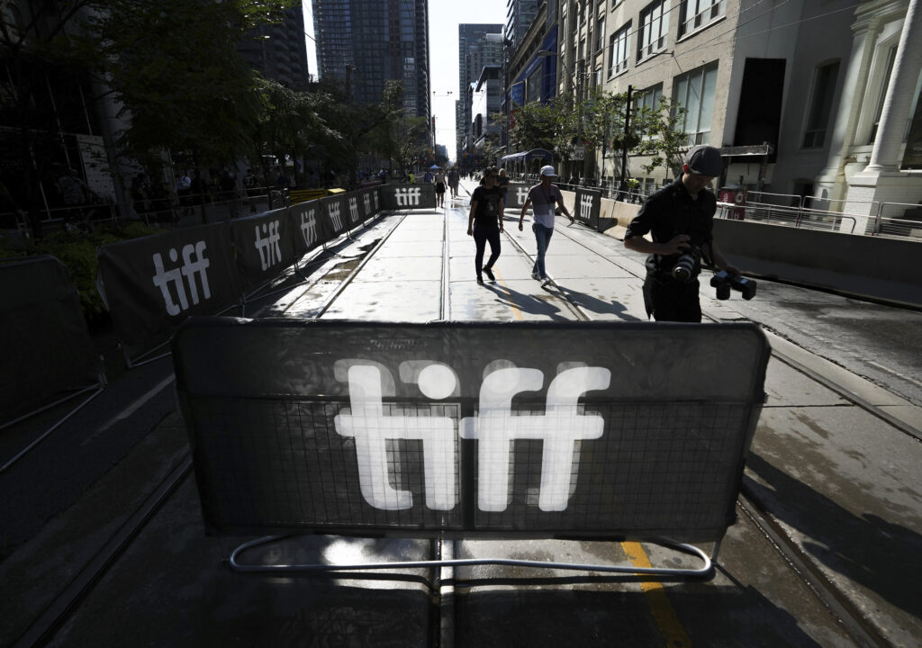 People walk the closed-off streets at the Toronto International Film Festival, in Toronto, Thursday, Sept. 7, 2023. Photo credit: Nathan Denette, The Canadian Press via The Associated Press