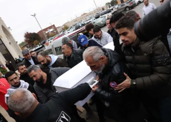 Six-year-old Wadea Al-Fayoume’s casket is carried into a funeral service Monday at the Mosque Foundation in Bridgeview, Illinois.Photo credit: Ashlee Rezin, Sun-Times