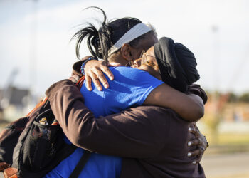 Sheneen McClain, right, mother of Elijah McClain, and friend and supporter MiDian Holmes embrace after suspended Aurora, Colorado, Police Officer Nathan Woodyard was acquitted in the 2019 death of Elijah, outside of the Adams County Justice Center on Monday, Nov. 6, 2023, in Brighton, Colorado. Photo credit: Hart Van Denburg, Colorado Public Radio via The Associated Press