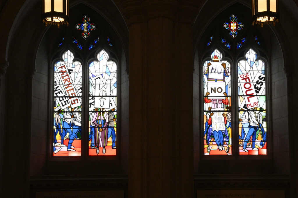 Light shines through new stained-glass windows with a theme of racial justice during an unveiling and dedication ceremony at the Washington National Cathedral for the windows on Saturday, Sept. 23, 2023, in Washington. The windows fill the space that had once held windows honoring Confederate Gens. Robert E. Lee and Stonewall Jackson. The new windows, titled “Now and Forever," are based on a design by artist Kerry James Marshall. Stained glass artisan Andrew Goldkuhle crafted the windows based on that design. Photo credit: Nick Wass, The Associated Press