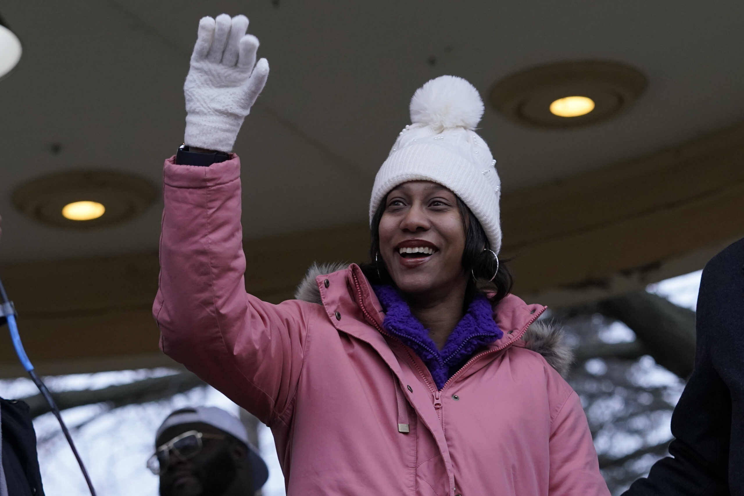 Brittany Watts waves to supporters at a rally on Thursday, Jan. 11, 2024, in Warren, Ohio. A grand jury decided Thursday that Watts, who was facing criminal charges for her handling of a home miscarriage, will not be charged. Photo credit: Sue Ogrocki, The Associated Press