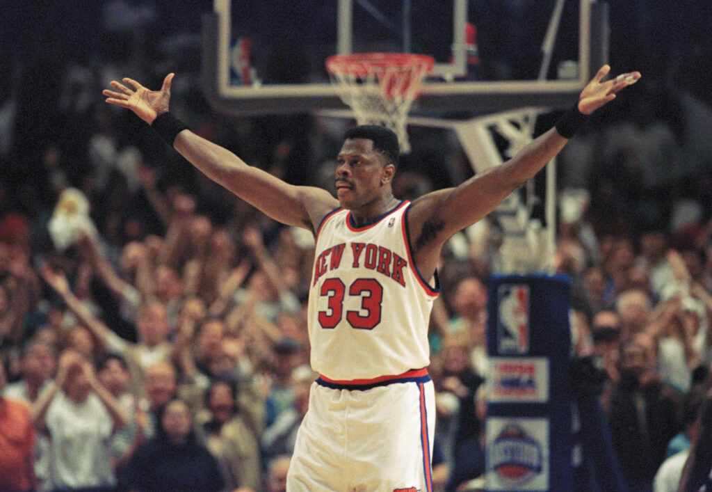 New York Knicks center Patrick Ewing pumps up the fans crowded into New York's Madison Square Garden in New York, Sunday, May 22, 1994, as the last few seconds tick away in the Knicks? NBA Playoff semifinal game against the Chicago Bulls. The Knicks won the game 87-77 and move on meet the Indiana Pacers in the finals. Photo credit: Bill Kostroun, The Associated Press