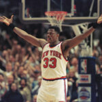 New York Knicks center Patrick Ewing pumps up the fans crowded into New York's Madison Square Garden in New York, Sunday, May 22, 1994, as the last few seconds tick away in the Knicks? NBA Playoff semifinal game against the Chicago Bulls. The Knicks won the game 87-77 and move on meet the Indiana Pacers in the finals. Photo credit: Bill Kostroun, The Associated Press
