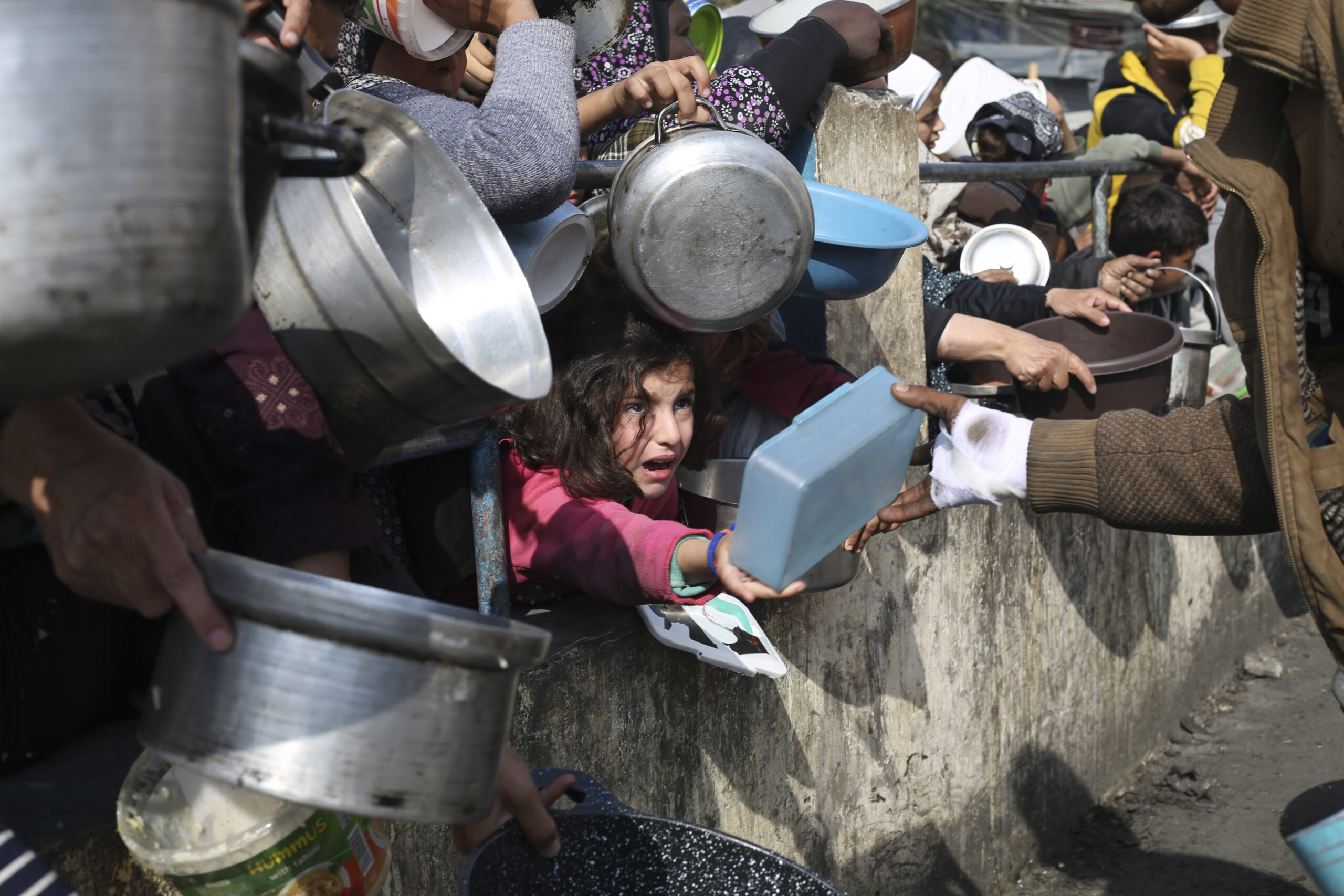 Palestinians line up for free food during the ongoing Israeli air and ground offensive on the Gaza Strip in Rafah, Tuesday, Jan. 9, 2024. Photo credit: Hatem Ali, The Associated Press