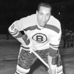 In this November 23, 1960, file photo, 25-year-old left wing Willie O'Ree, the first Black player of the National Hockey League, warms up in his Boston Bruins uniform, prior to the game with the New York Rangers, at New York's Madison Square Garden. Photo credit: The Associated Press